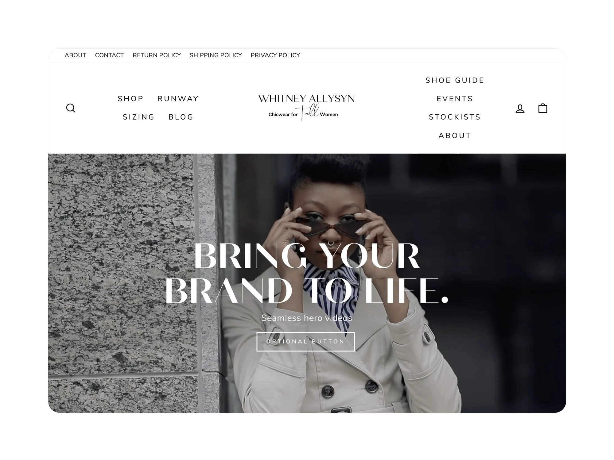Fashion model in beige coat adjusting sunglasses, overlayed text reading 'Bring your brand to life' with an optional button for hero video.
